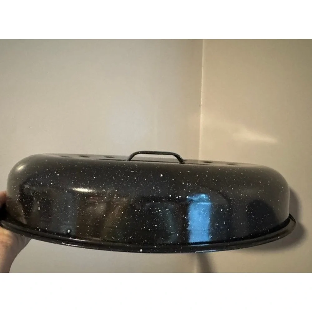 Granite Ware 15-inch oval roaster pan with a lid, speckled black enamel finish.